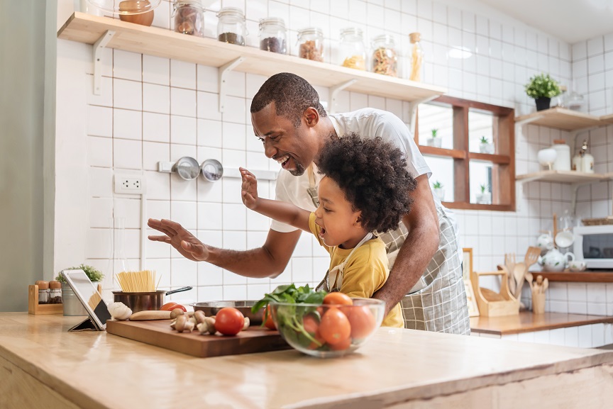 Father son  video call digital tablet family cooking in kitchen 354080641