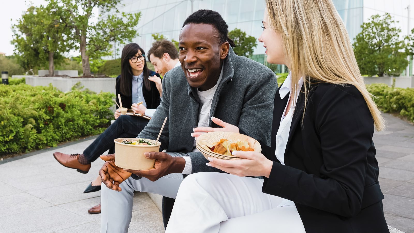 Colleagues enjoy a healthy lunch