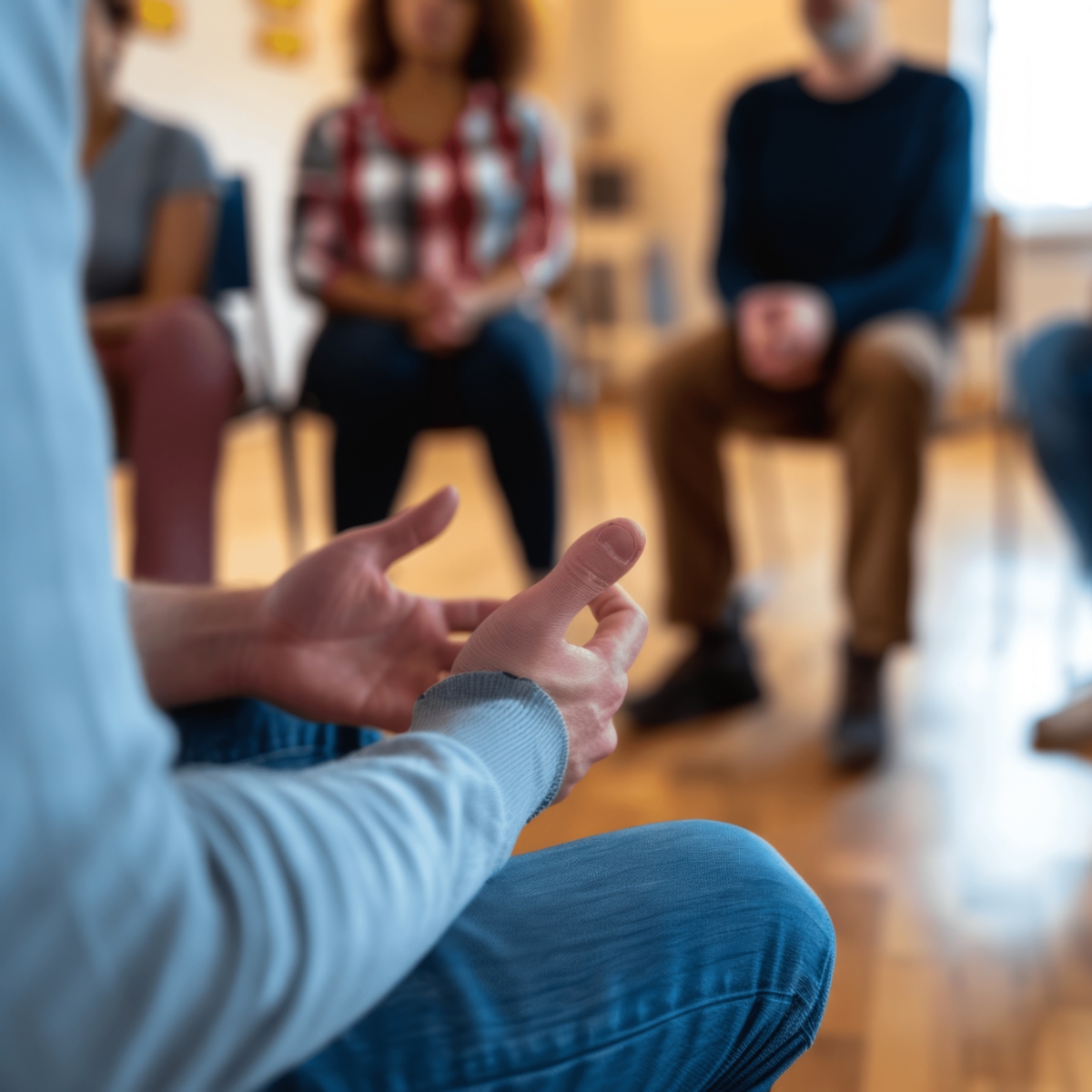 Group session with and individual showing open hands