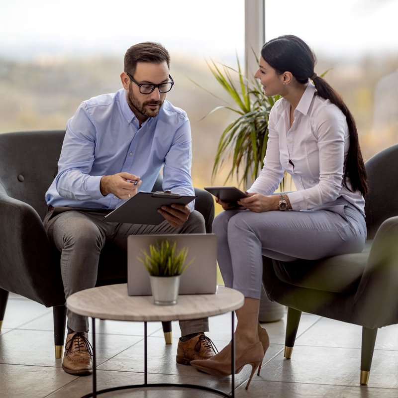 Male and female meeting to review documents