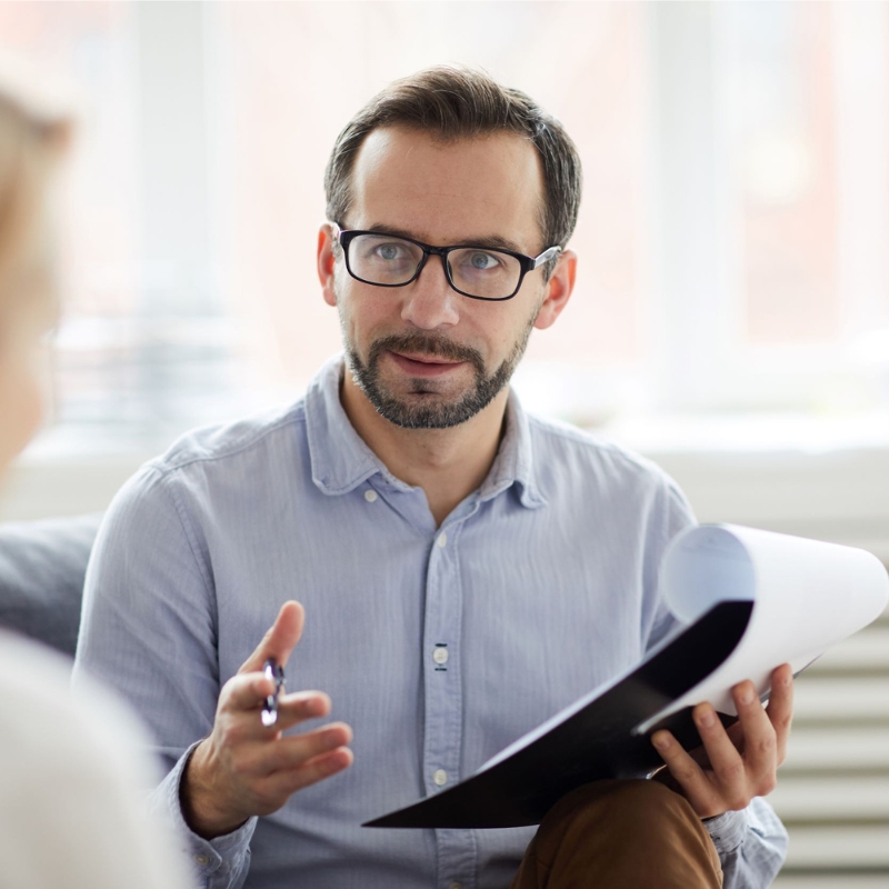 Man explaining data to another individual