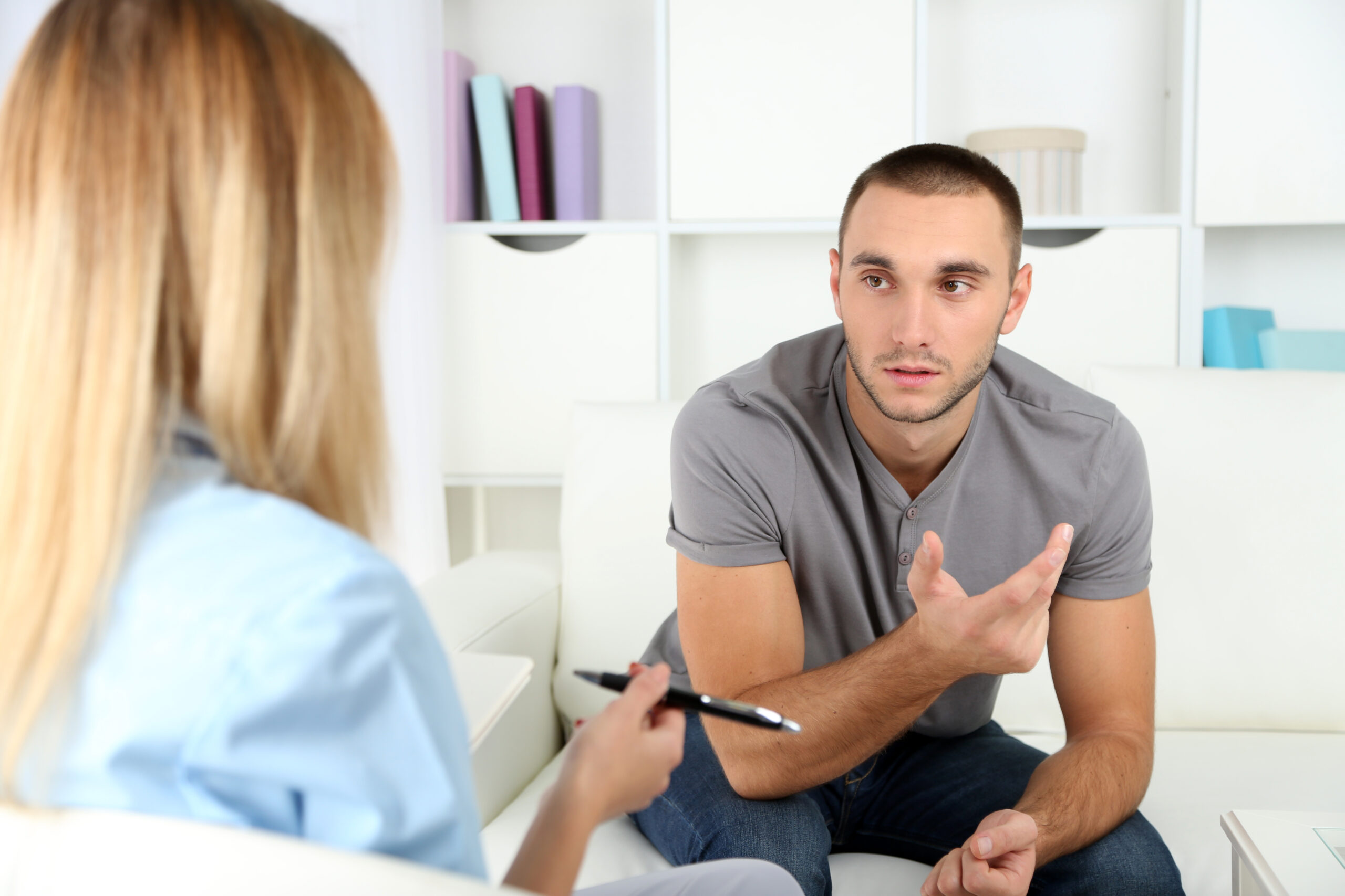 Woman conversing with another employee